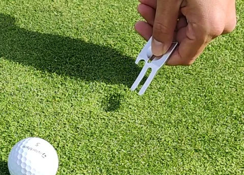 What is a golf divot pitch mark?